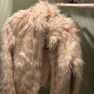 A fashion nova, medium size jacket, faux fur in the color pink